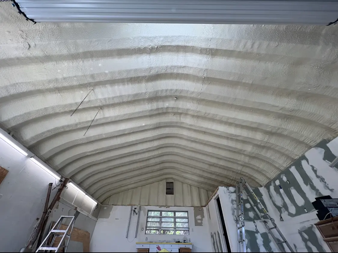 Spray polyurethane foam applied to the underside of a metal roof deck in Crawfordville